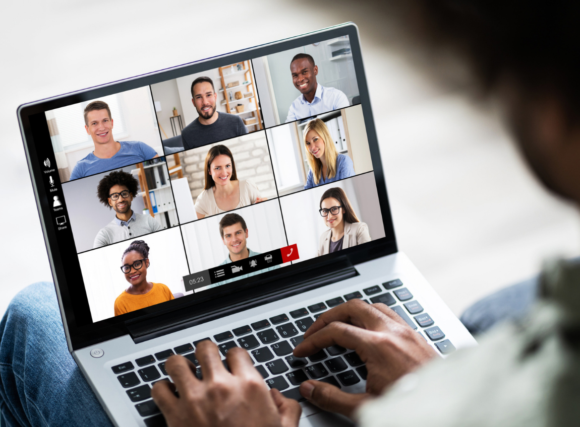 A Black man joins a video call from his laptop with peers.